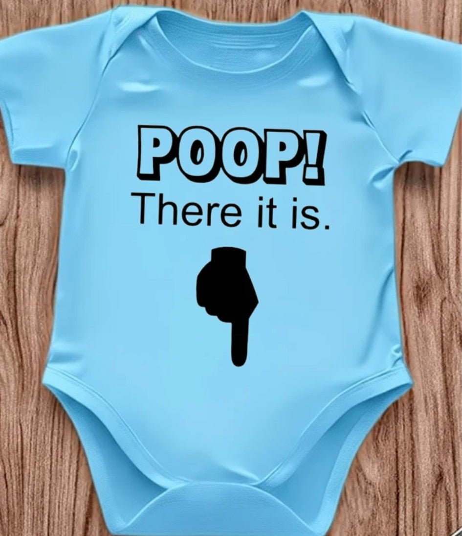 Funny baby onesie with the text 'Poop! There it is' on a wooden background